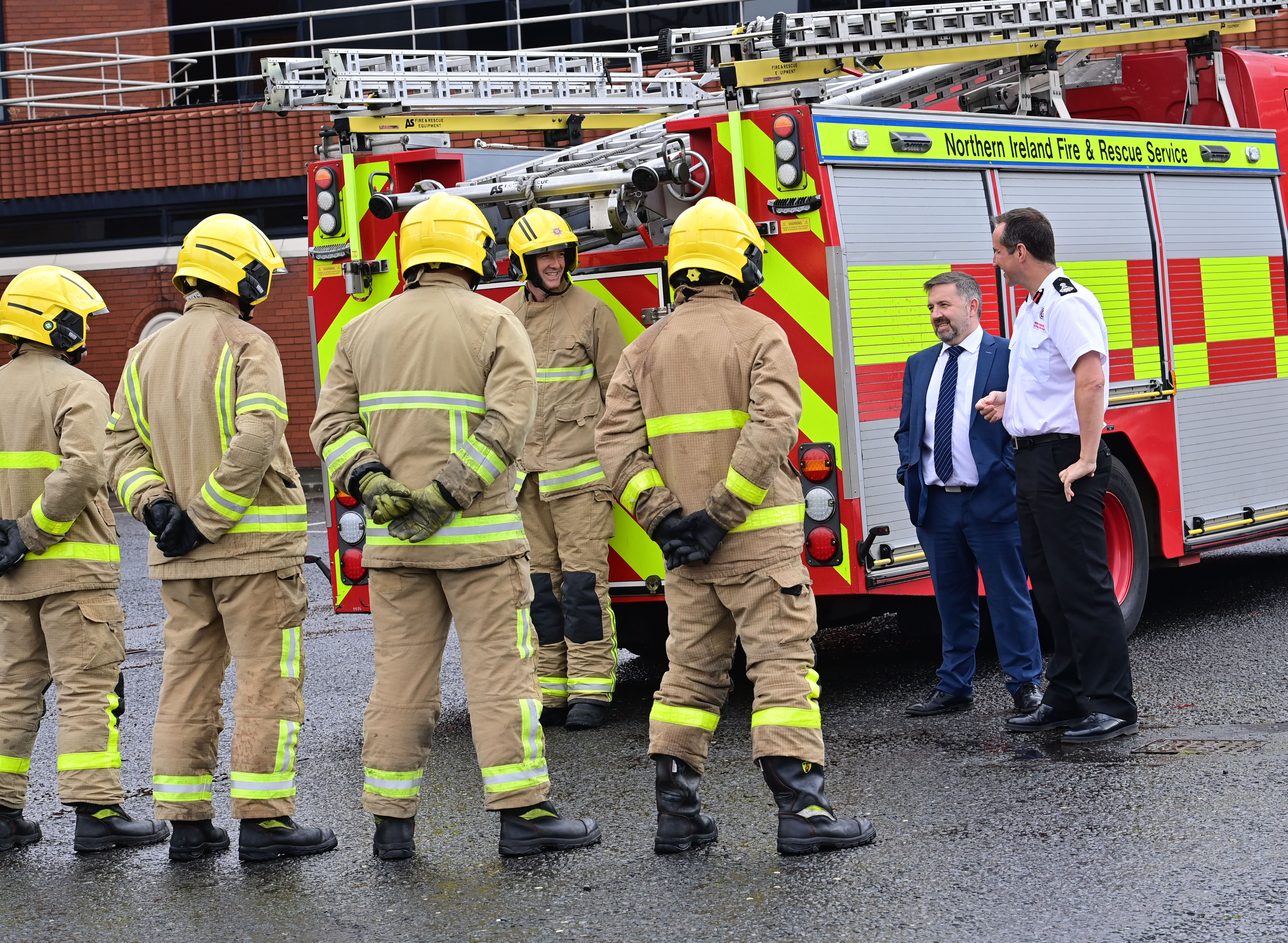 Health Minister Robin Swann with NIFRS Chief Fire and Rescue Officer Andy Hearn meeting fire crews.