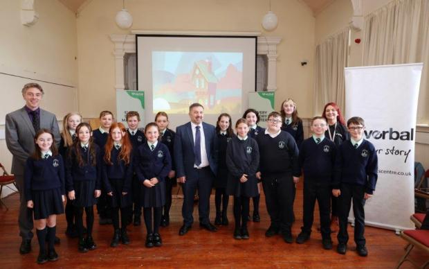 Minister Swann pictured with the Verbal team delivering Verbal Wellbeing session with Long Tower Primary School P7 class accompanied by Teacher Mr I Gallagher