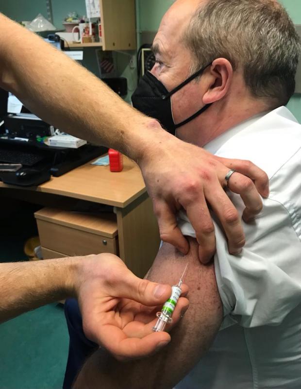 CMO Professor Sir Michael McBride receiving his vaccination