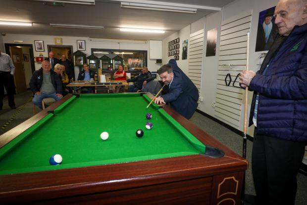 Minister Swann takes time out to enjoy a game of pool with one of the members of North Belfast Men's ShedBelfast Men's Shed