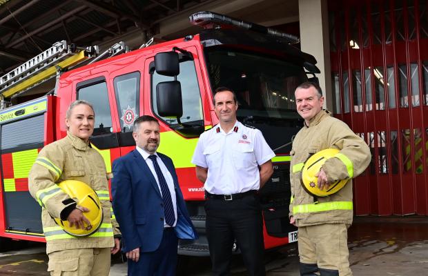 Pictured with Health Minister Robin Swann and NIFRS Chief Fire and Rescue Officer Andy Hearn at Central Fire Station are Crew Commanders Lynsey Miller and Jonny Caughey