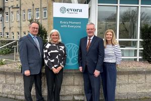 Photo of Health Minister Mike Nesbitt with Evora officials