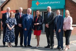 Photo of Health Minister with Carryduff Pharmacy staff, Secretary of State, Hilary Benn MP; Health Minister Mike Nesbitt; deputy First Minister Emma Little-Pengelly; Finance Minister John O'Dowd; NIO Minister Matthew Patrick