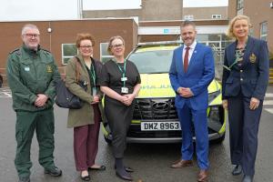 Photo Of Health Minister and officials in front of a paramedic car