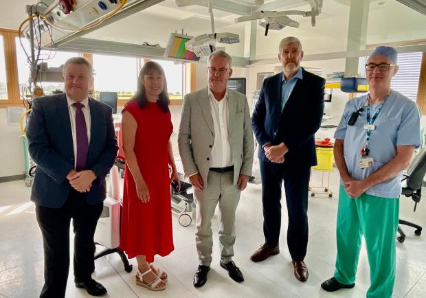 Professor Mark Taylor; Roisin Coulter, Chief Executive South Eastern Trust; Health Minister Mike Nesbitt; Finance Minister John O'Dowd and Downe Hospital theatre manager Paul Reilly at Downe Hospital Day Procedure Unit
