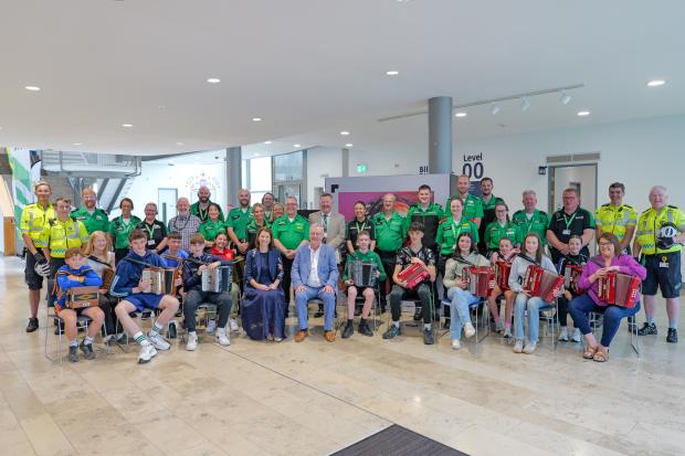 Health Minister Mike Nesbitt with volunteers, musicians, St John Ambulance clinicians and emergency responders at the Fleadh medical hub in Ulster University’s Belfast campus.