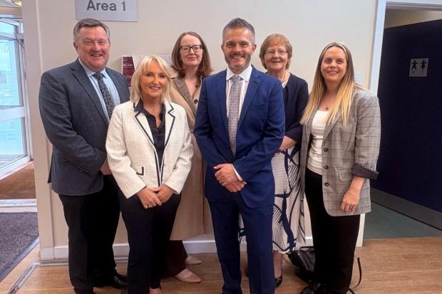 Photo of Health Minister Robbie (centre) Butler and Professor Mark Taylor (left) with South West GP Federation and FSU representatives