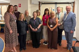 Health Minister Mike Nesbitt and Professor Mark Taylor with the Belfast Trust Validation Team 